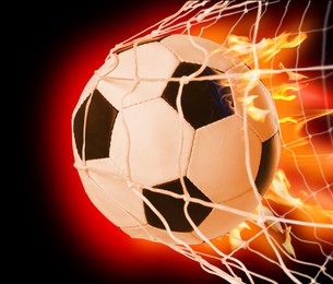 Image of Soccer ball with fire in net on color background