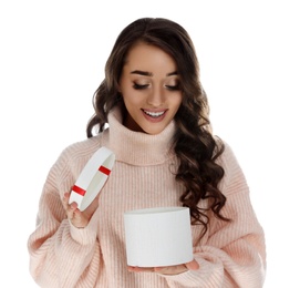 Photo of Beautiful young woman opening Christmas gift on white background