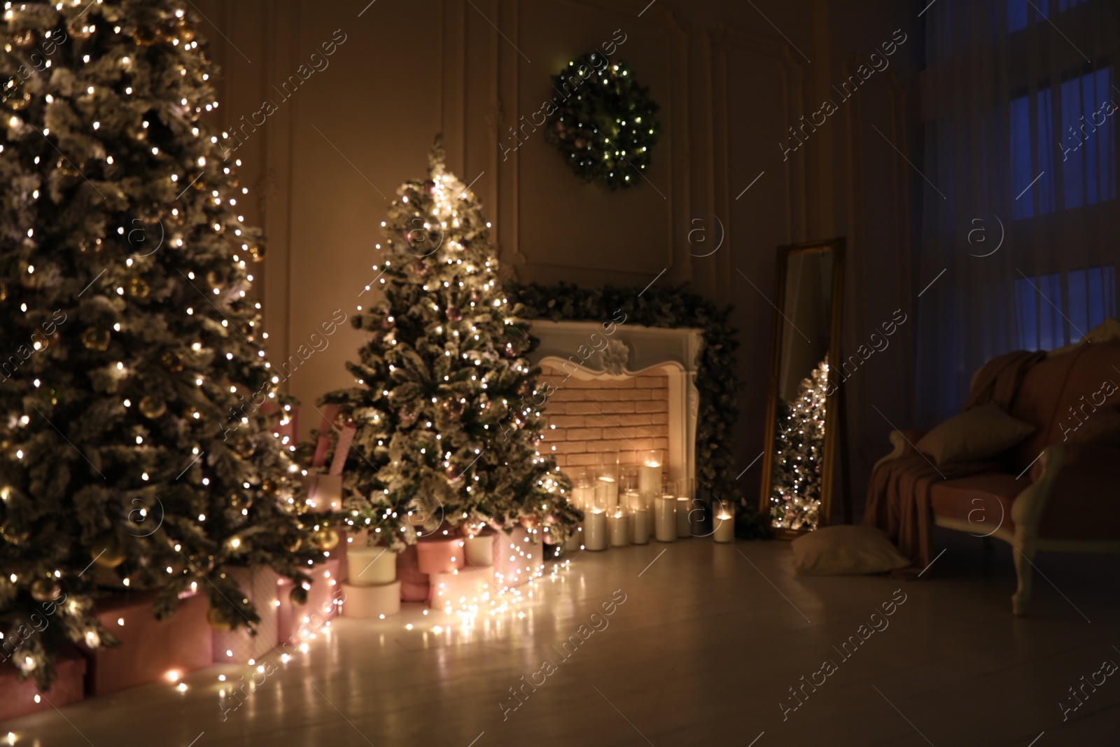 Photo of Blurred view of festive room interior with Christmas trees