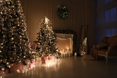 Blurred view of festive room interior with Christmas trees