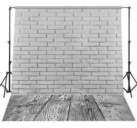 Image of Photo background with white brick wall and wooden floor. Professional studio equipment