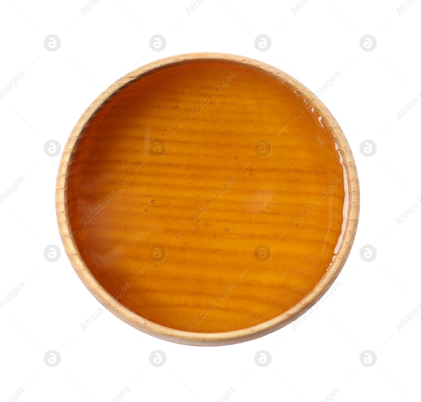 Photo of Tasty honey in bowl isolated on white, top view