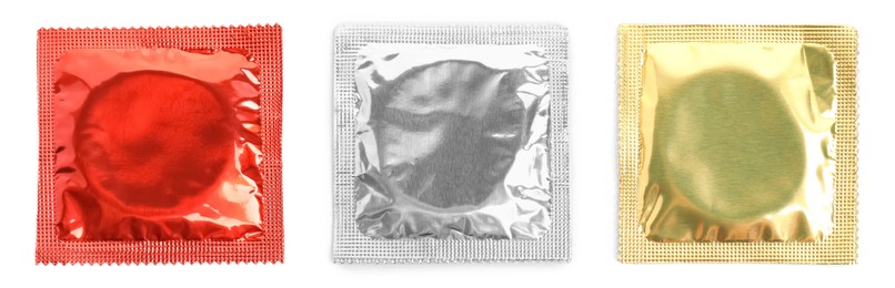 Image of Set with condoms in packages on white background, top view. Banner design 