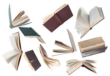 Image of Many hardcover books falling on white background