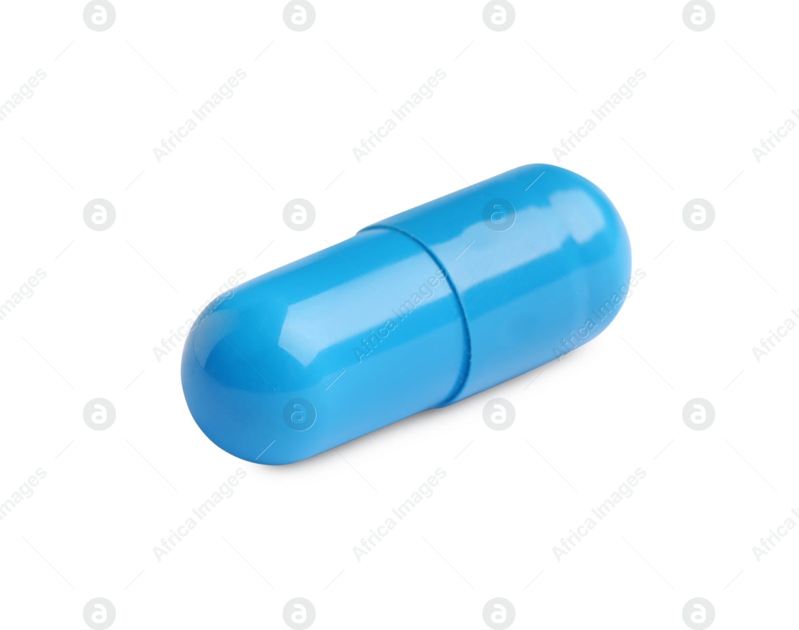 Photo of One light blue pill on white background. Medicinal treatment