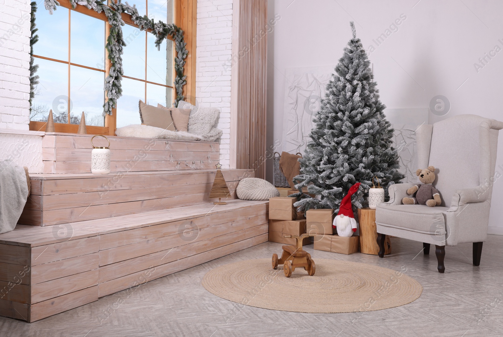 Photo of Stylish room interior with Christmas tree and festive decor