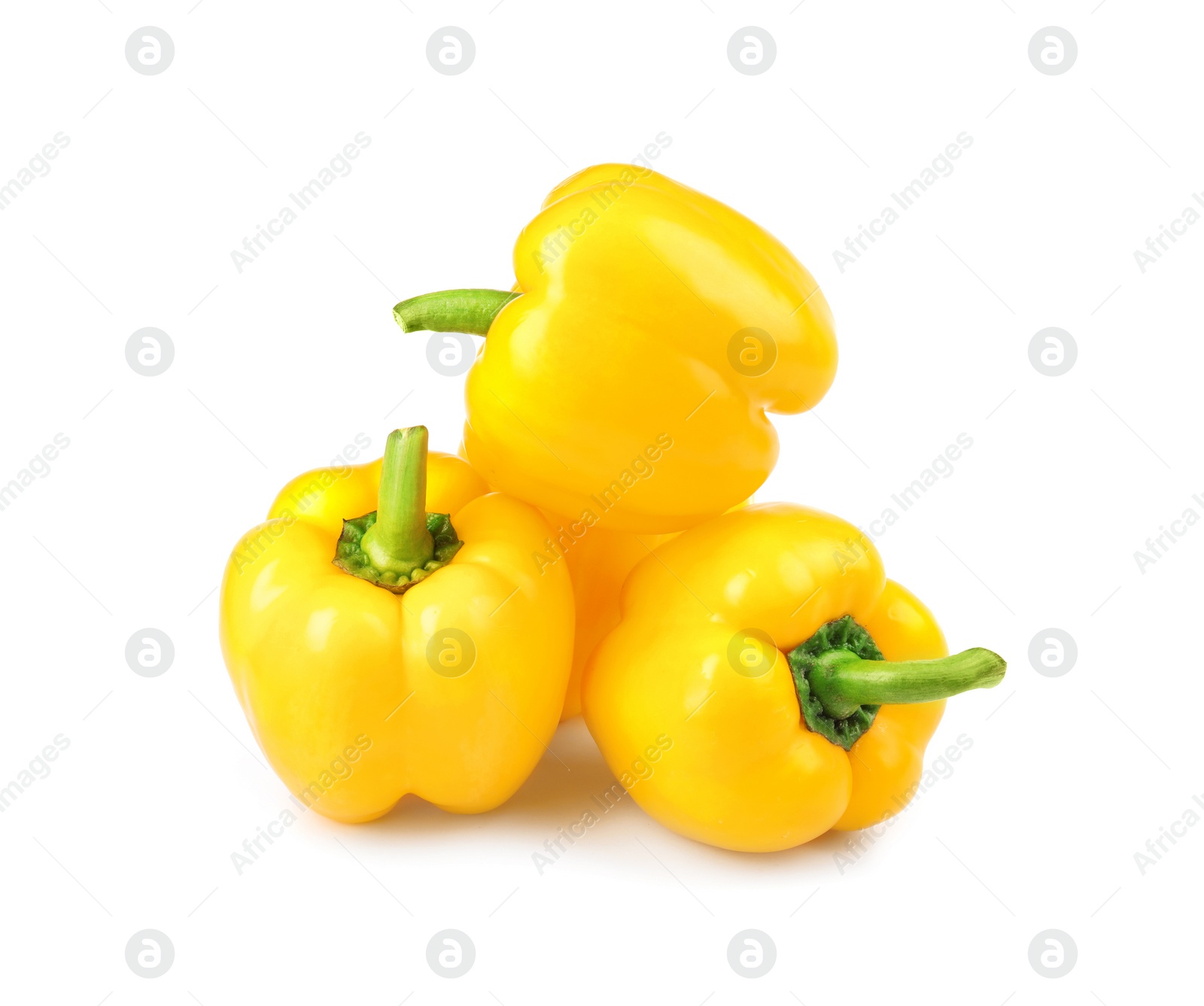 Photo of Ripe yellow bell peppers isolated on white