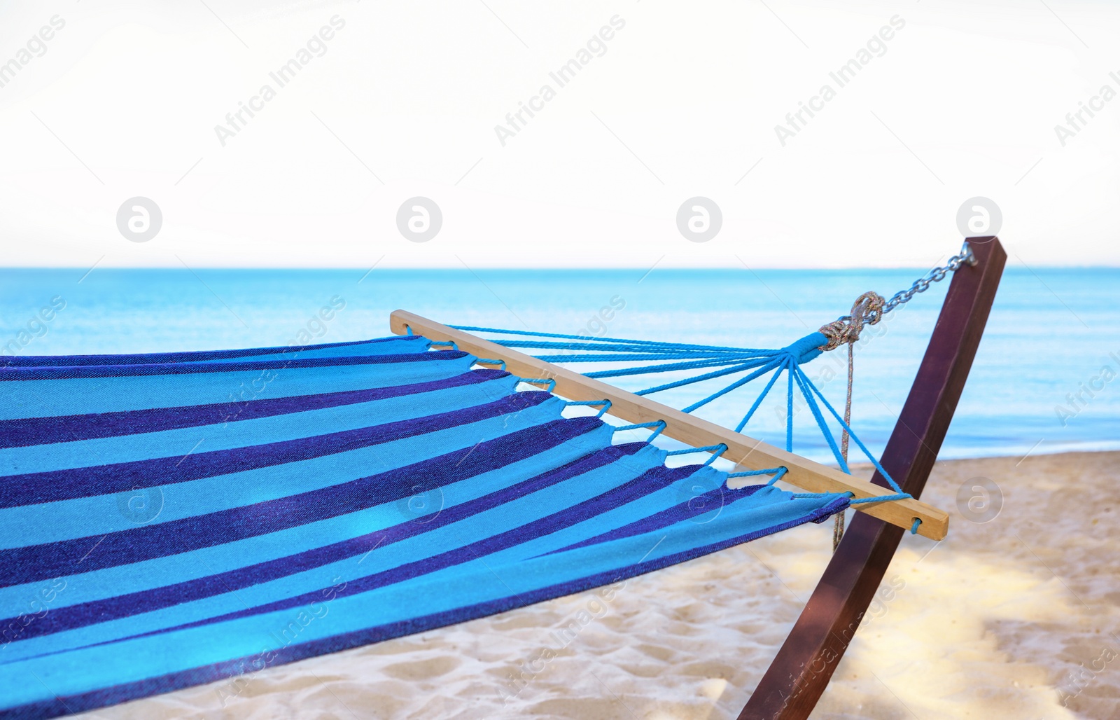 Photo of Empty hammock at seaside. Time to relax