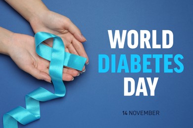 Image of World Diabetes Day. Woman holding light blue ribbon on color background, top view