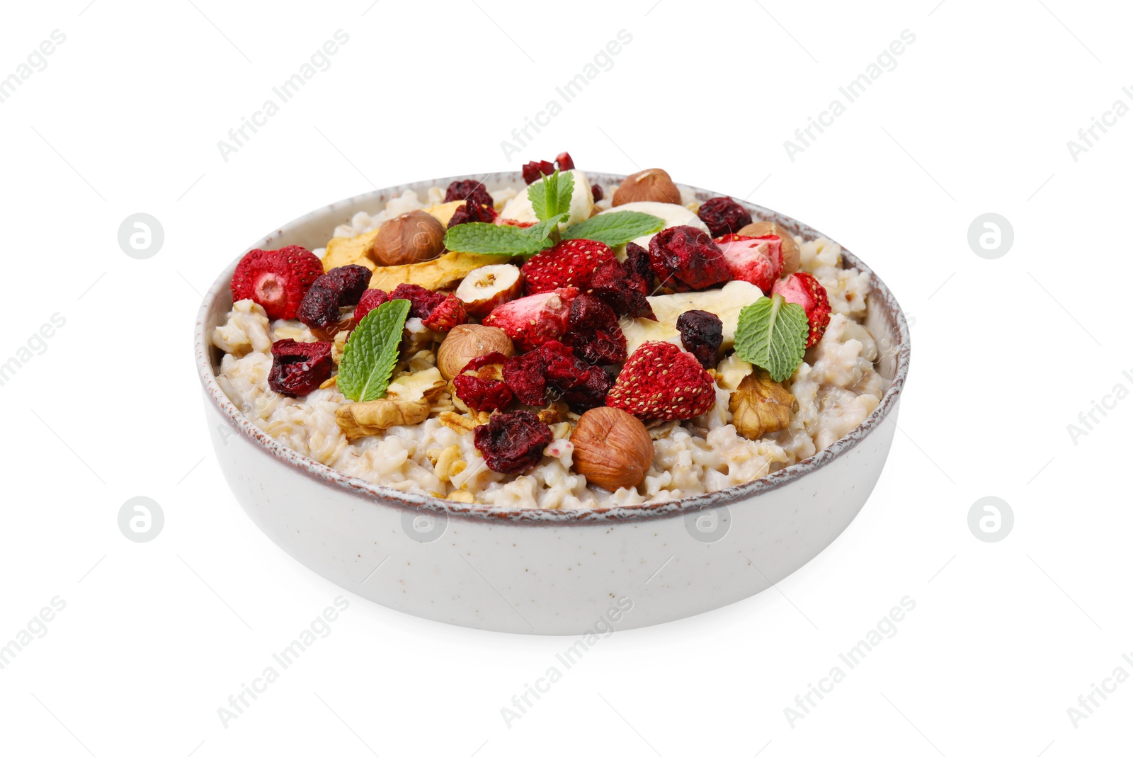 Photo of Oatmeal with freeze dried fruits, nuts and mint isolated on white