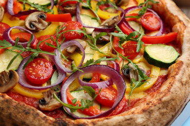 Delicious hot vegetable pizza with mushrooms, closeup