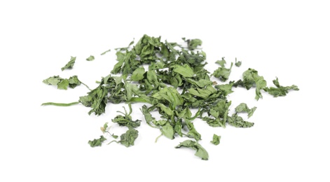 Photo of Scattered aromatic dried parsley on white background