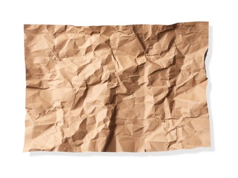 Photo of Crumpled kraft paper sheet isolated on white, top view