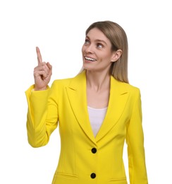 Photo of Beautiful happy businesswoman pointing at something on white background