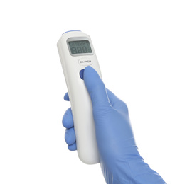 Photo of Doctor in latex gloves holding non contact infrared thermometer on white background, closeup. Measuring temperature