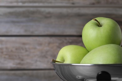 Photo of Ripe green apples on wooden background, closeup. Space for text