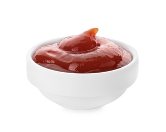 Photo of Tasty ketchup in bowl isolated on white