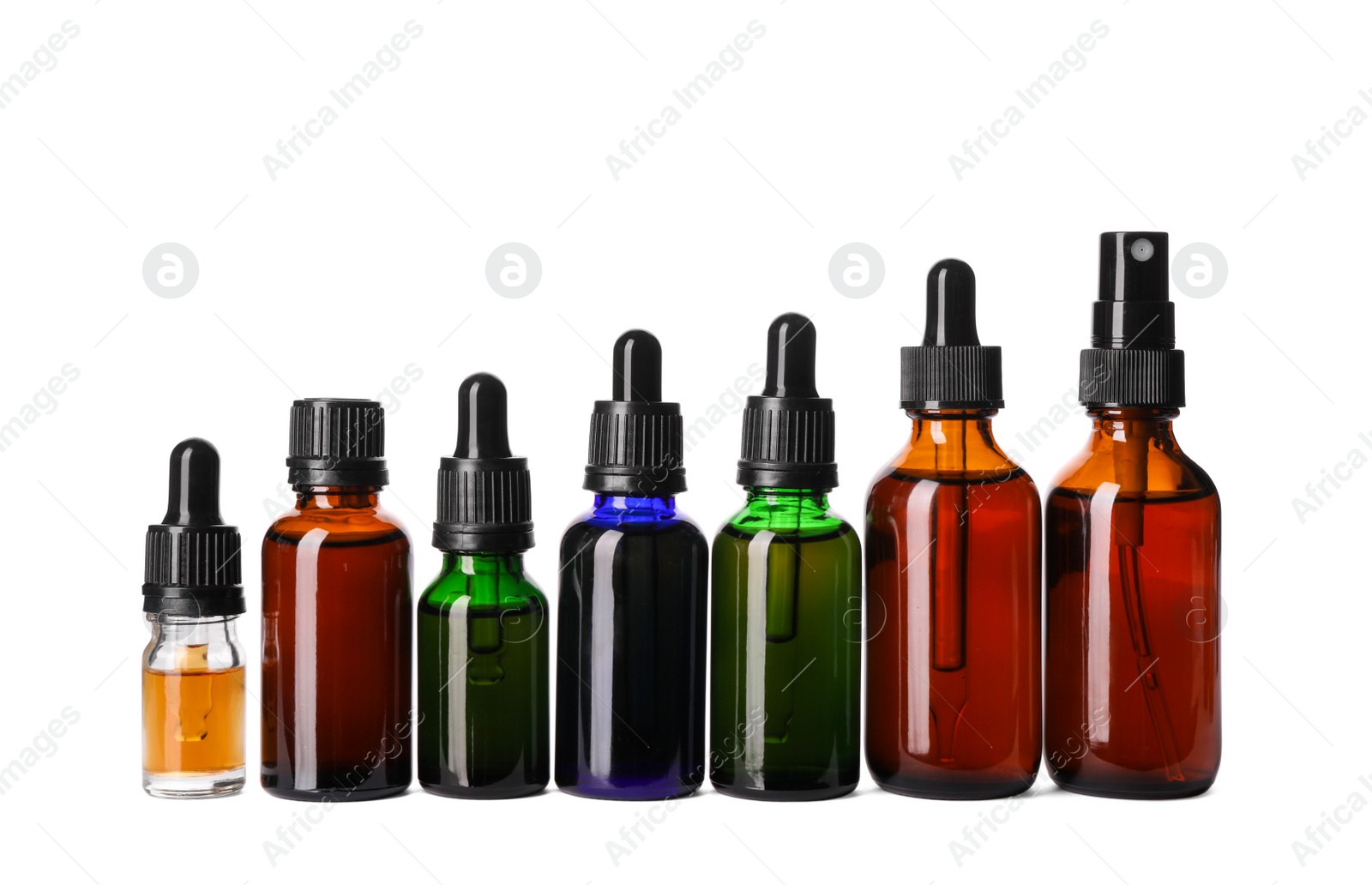 Photo of Cosmetic bottles of essential oils on white background