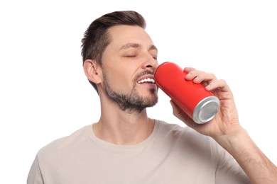 Photo of Happy man drinking from tin can on white background