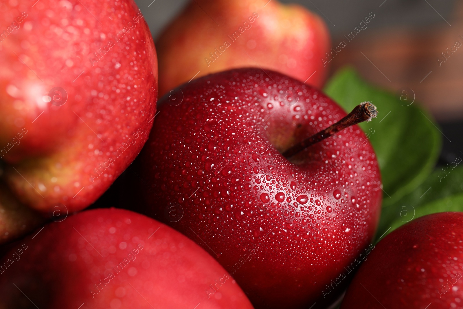 Photo of Fresh ripe red apples with water drops, closeup