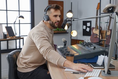 Man working as radio host in modern studio