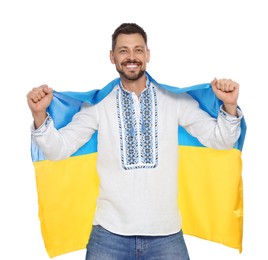 Photo of Happy man in Ukrainian national clothes with flag of Ukraine on white background