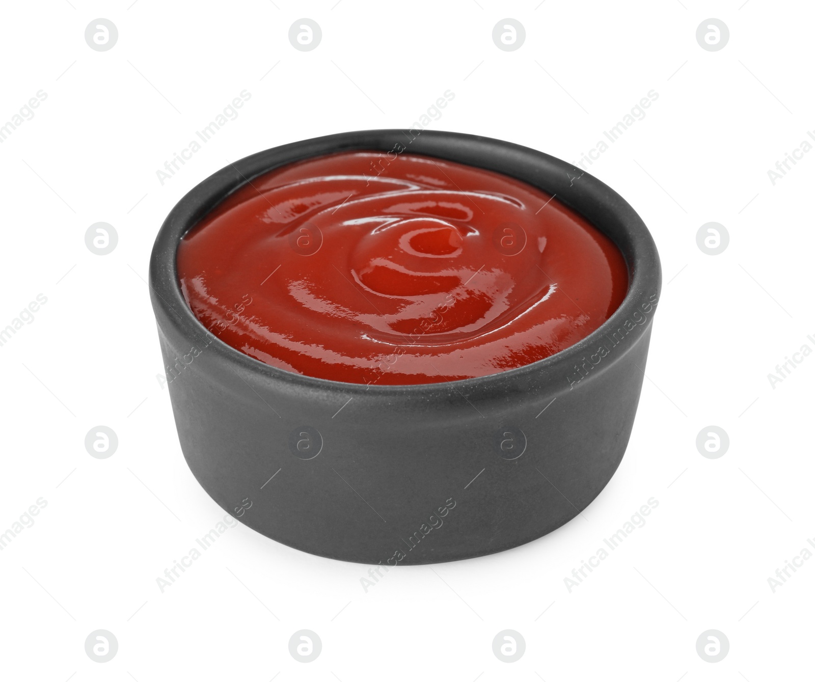 Bowl of tasty ketchup isolated on white. Tomato sauce Photo of Bowl of tasty ketchup isolated on white. Tomato sauce