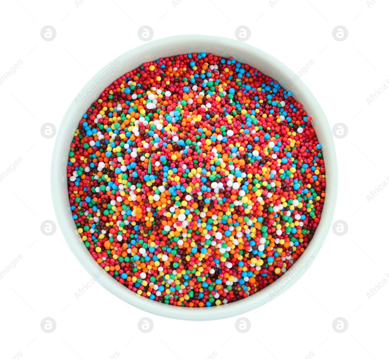 Photo of Colorful sprinkles in bowl on white background, top view. Confectionery decor