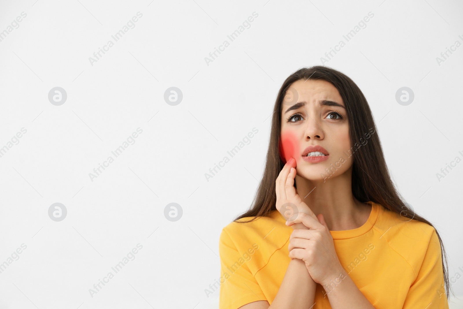 Image of Young woman suffering from toothache on white background