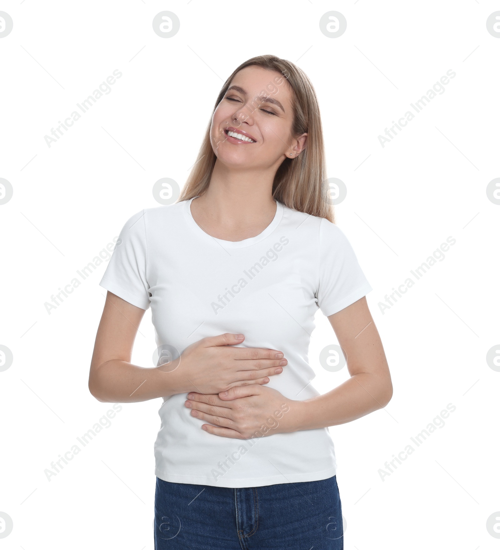 Photo of Happy woman touching her belly on white background. Concept of healthy stomach