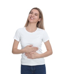 Photo of Happy woman touching her belly on white background. Concept of healthy stomach