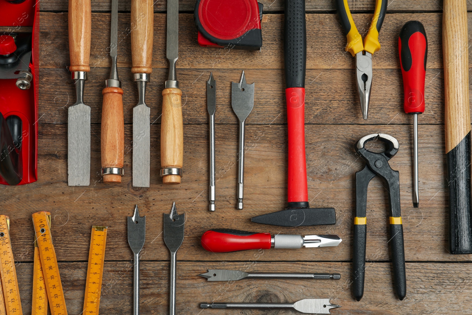 Photo of Flat lay composition with carpenter's tools on wooden background