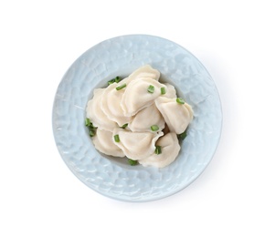 Plate of tasty dumplings served with green onion on white background, top view