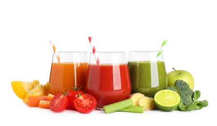 Different tasty juices and fresh ingredients on white background