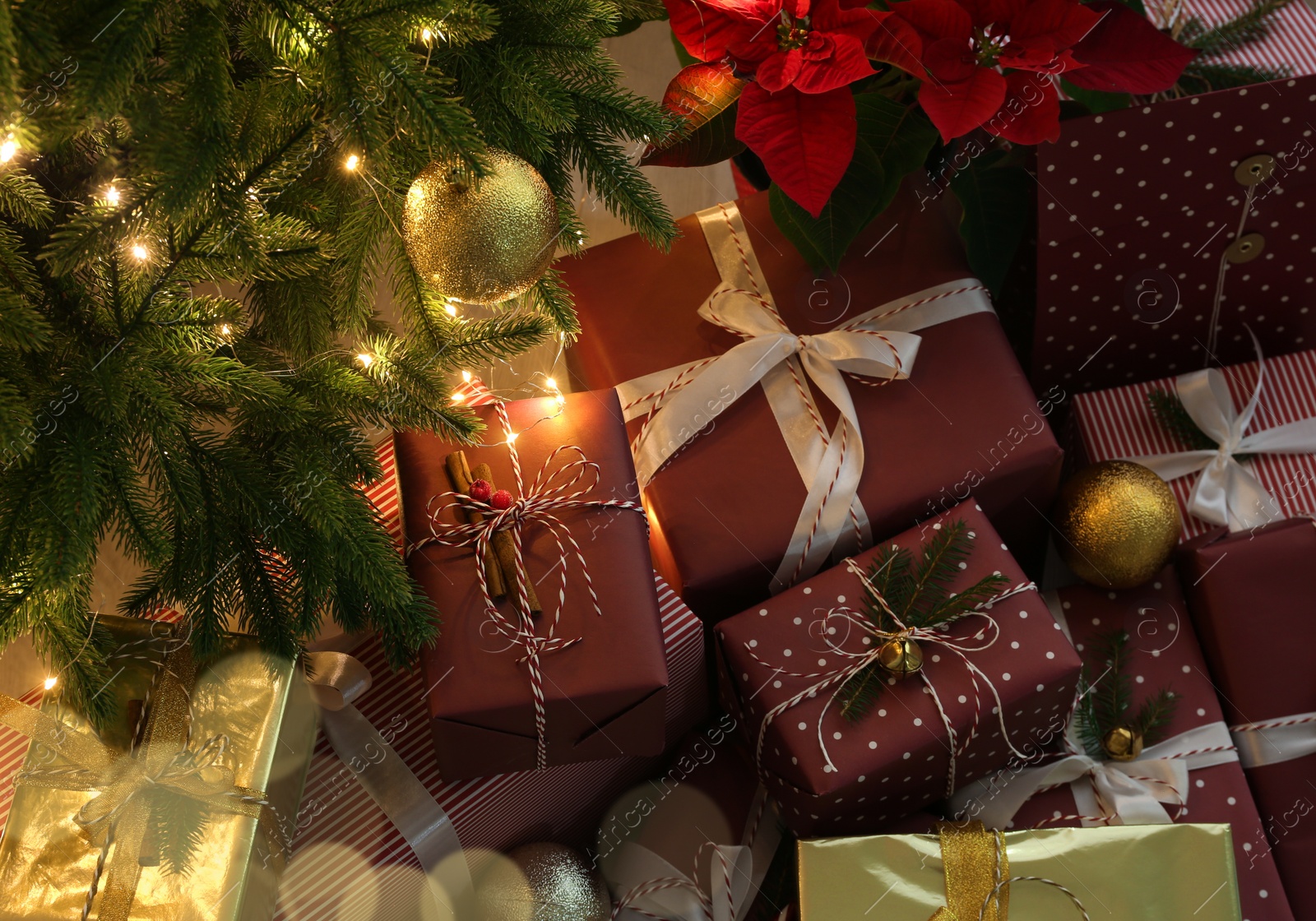 Photo of Many different beautiful gifts under Christmas tree