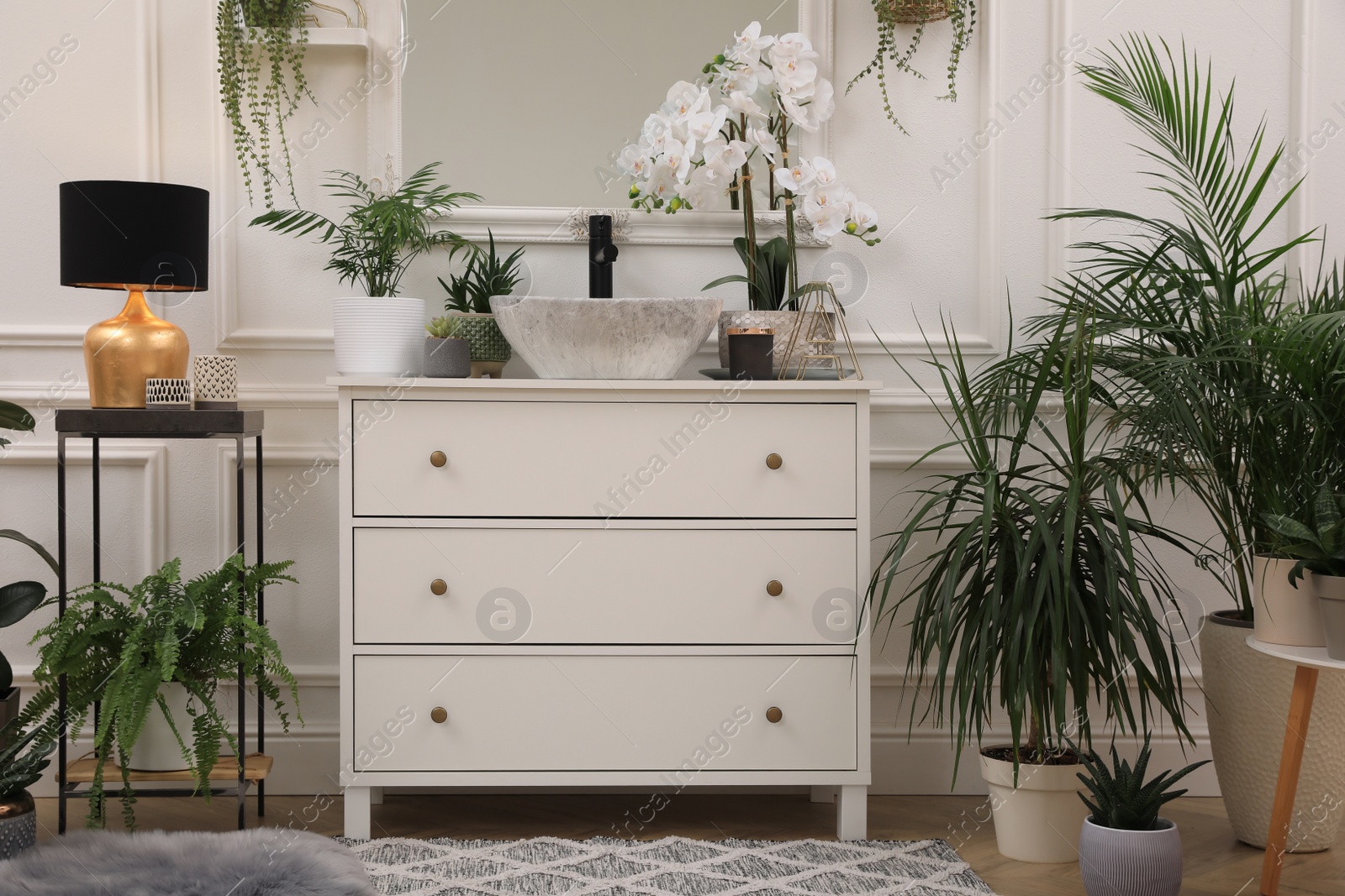 Photo of Stylish bathroom interior with modern furniture and beautiful houseplants