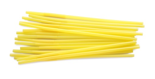 Photo of Yellow plastic cocktail straws on white background, top view