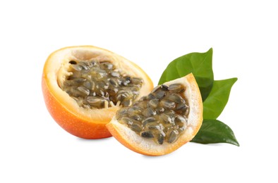 Photo of Cut delicious ripe granadilla with green leaves on white background