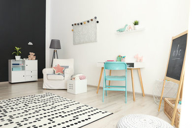 Modern child room interior with stylish furniture