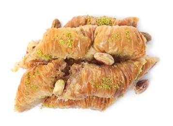 Photo of Delicious baklava with pistachio nuts on white background, top view