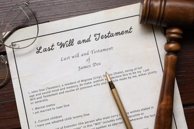 Last Will and Testament with glasses, gavel and pen on wooden table, flat lay