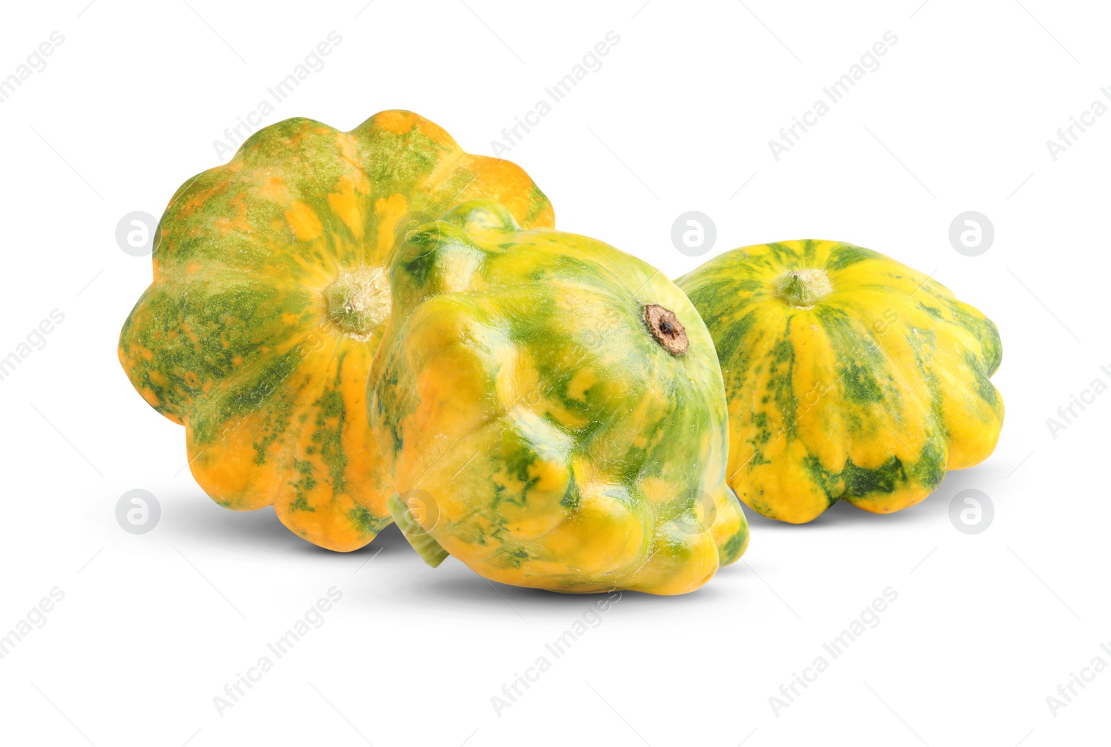 Image of Three fresh yellow pattypan squashes on white background