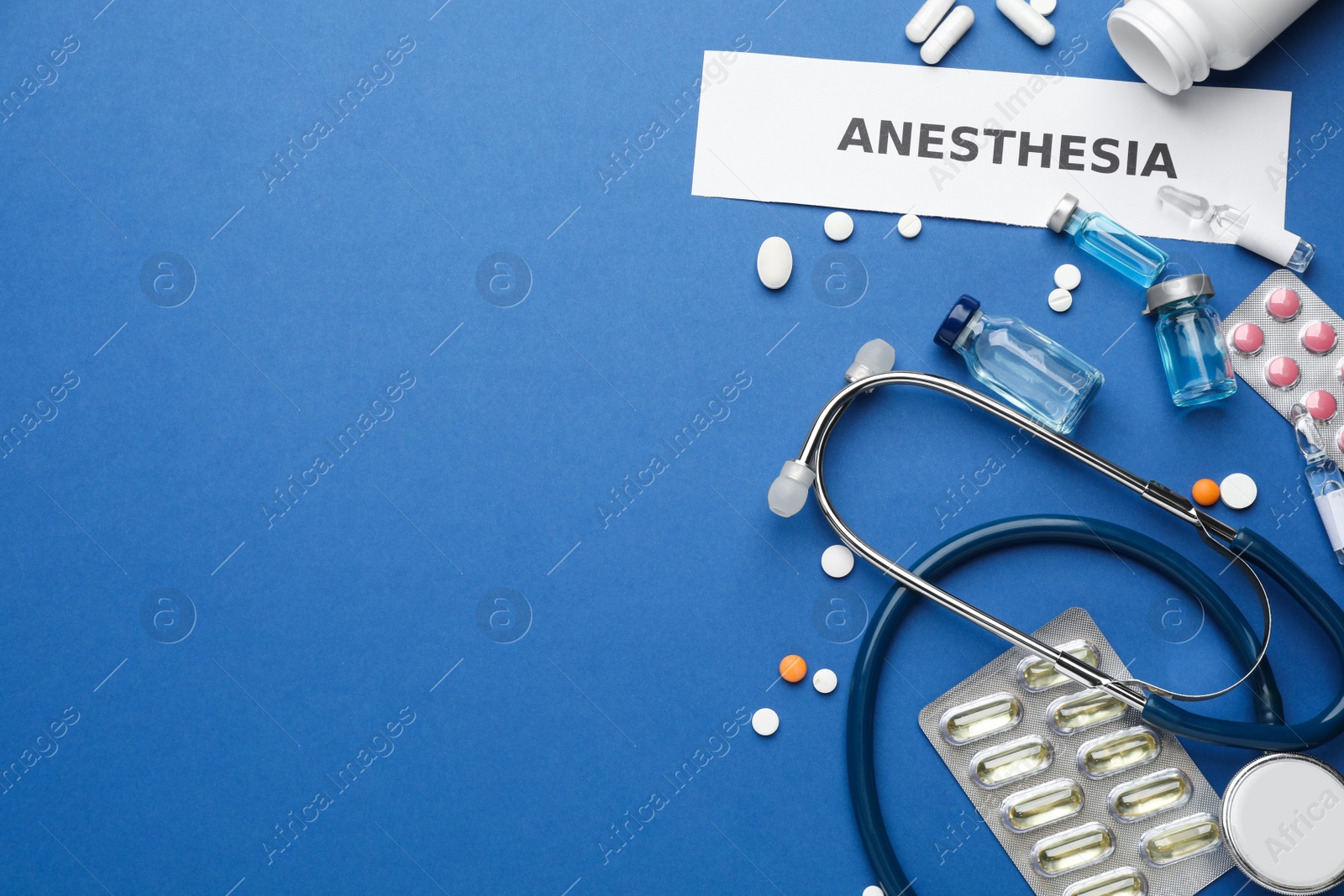 Photo of Flat lay composition with word Anesthesia and drugs on blue background, space for text