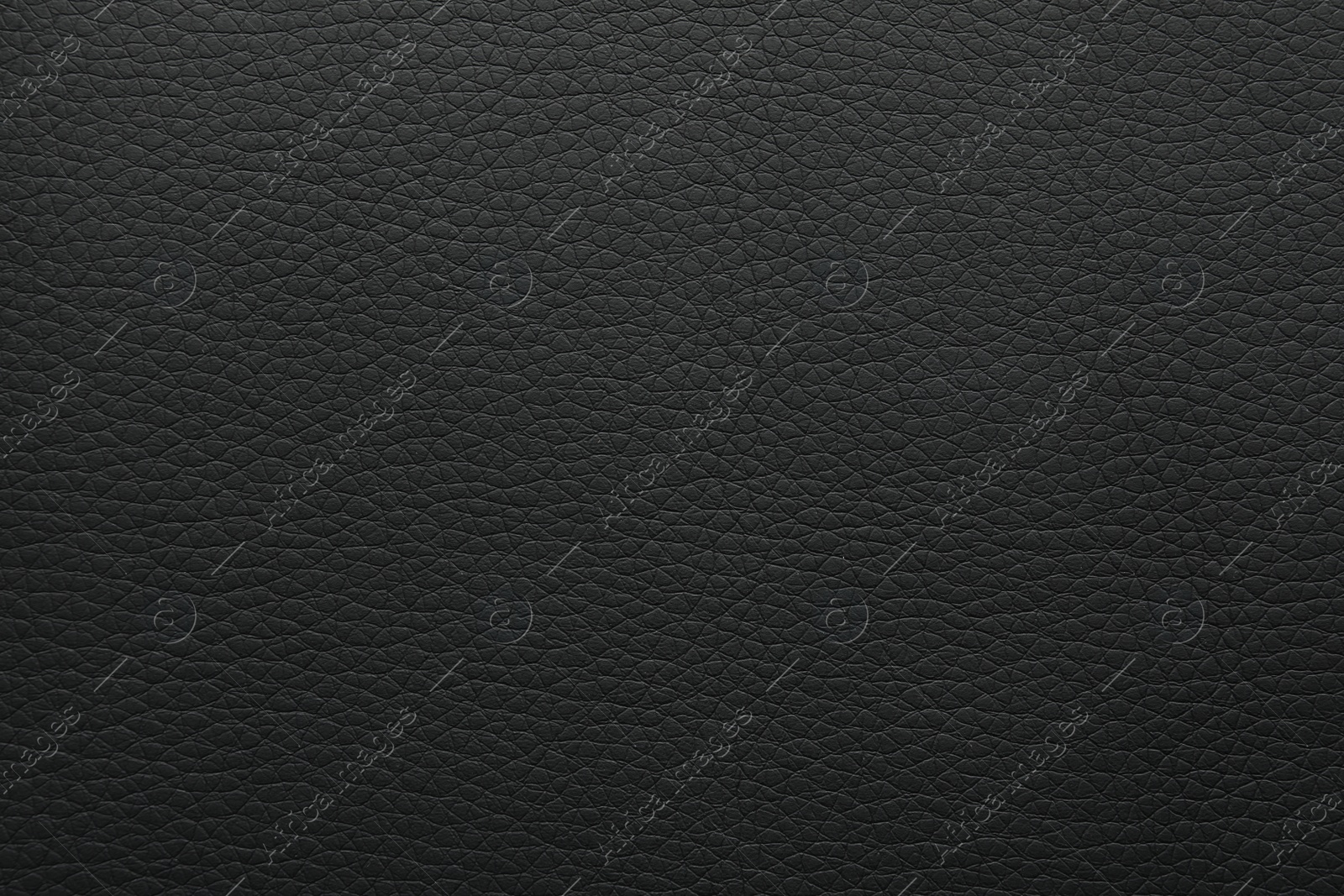 Photo of Texture of black leather as background, closeup