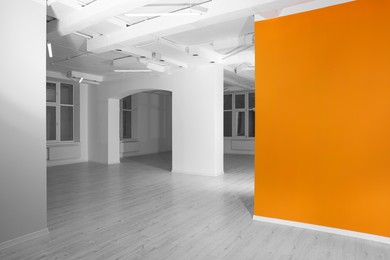 Photo of Empty renovated room with white and orange walls