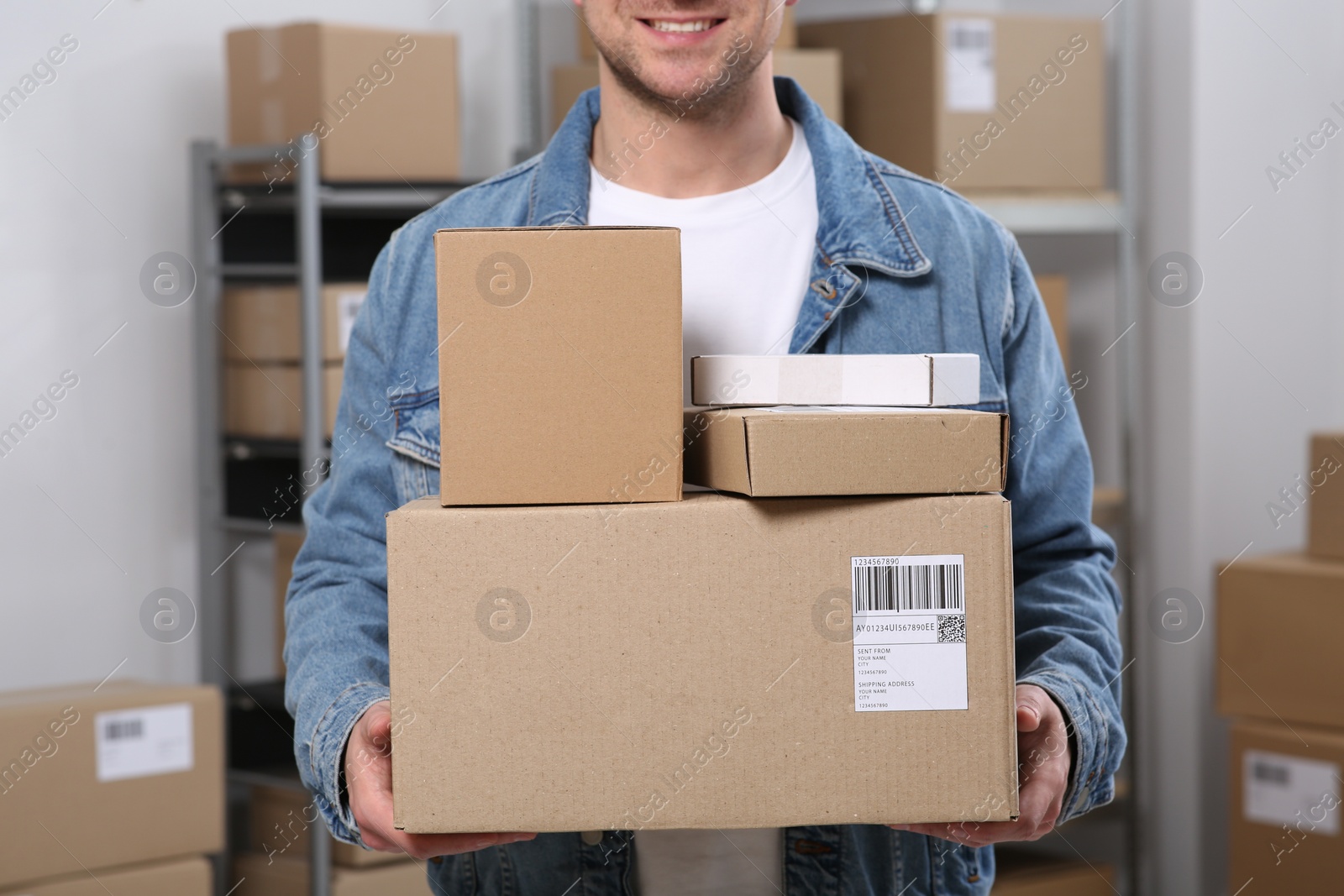 Photo of Seller with parcels in office, closeup. Online store