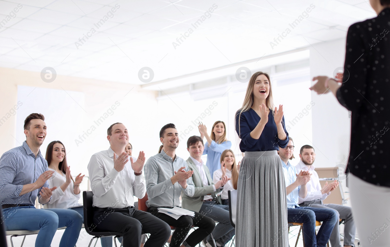 Photo of Young people having business training in office