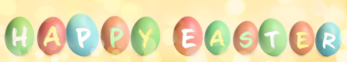 Image of Happy Easter. Colorful dyed eggs on yellow background, banner design