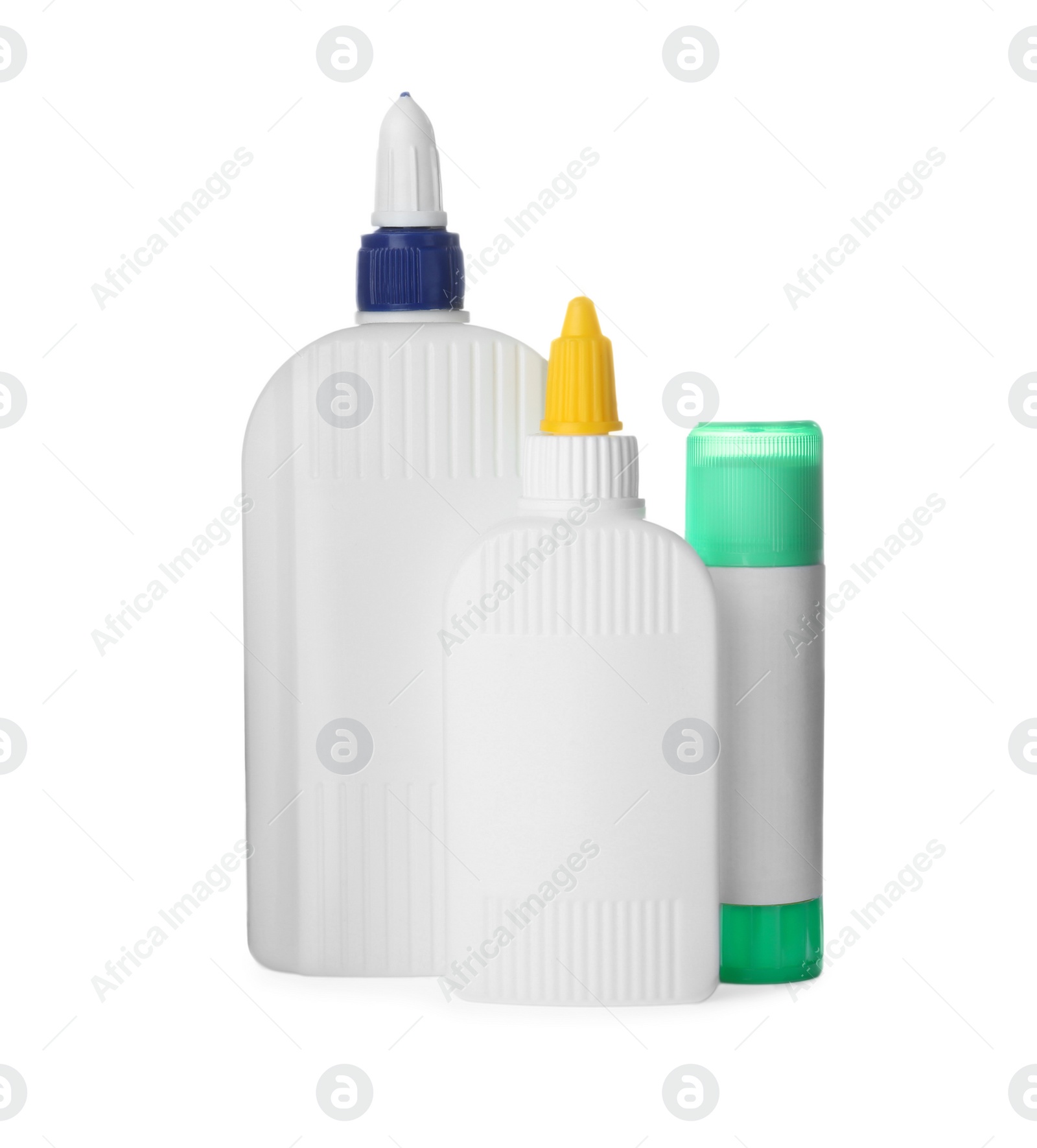 Photo of Different bottles and stick of glue on white background