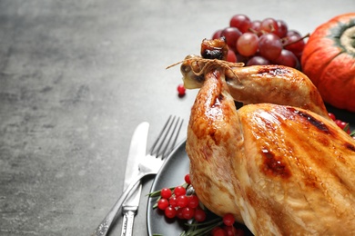 Delicious turkey on grey background, space for text. Happy Thanksgiving day